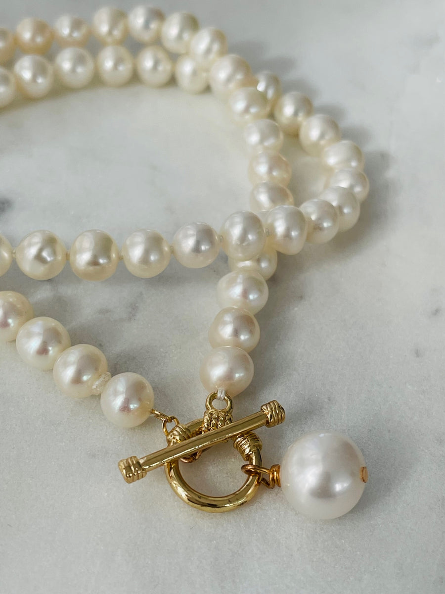 Long pearl strand deals necklace